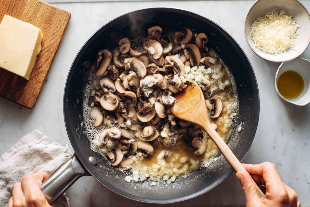Sautéing mushrooms for Creamy Mushroom Pasta